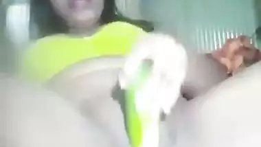 Naked Assamese girl fucks her pussy with a cucumber